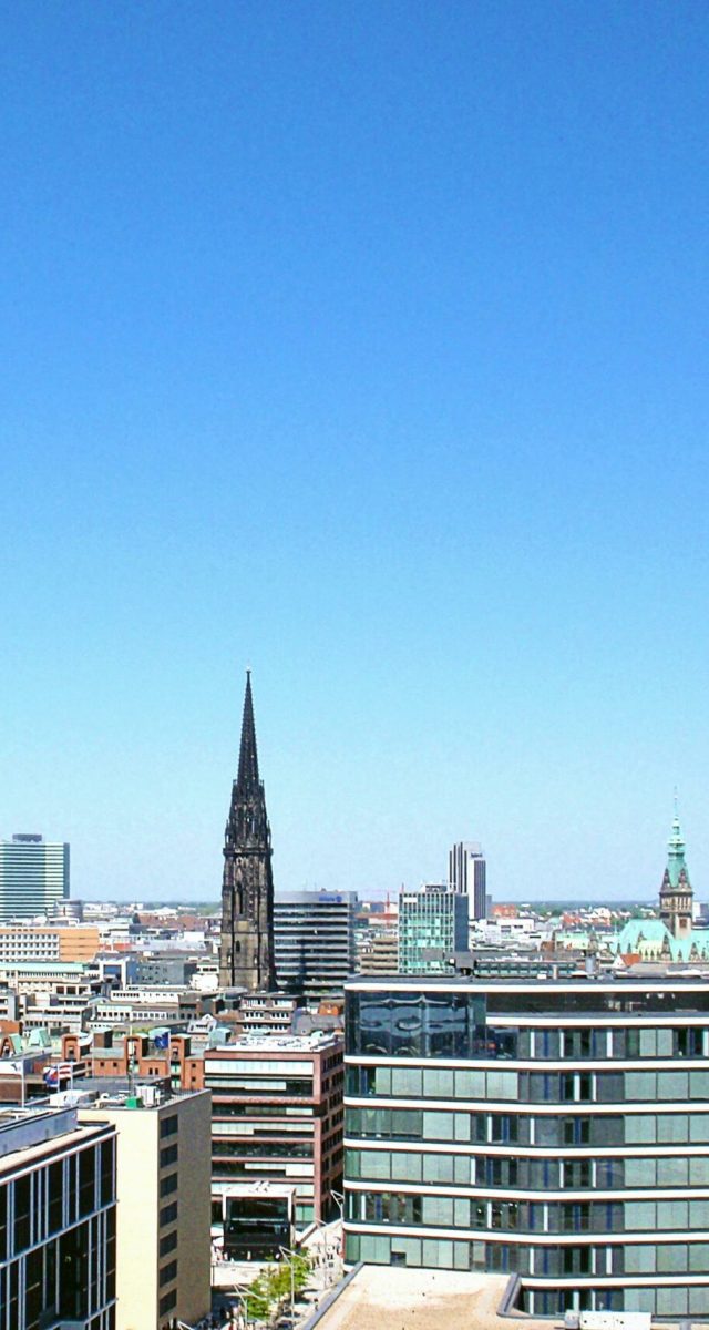 pexels-photo-39152-39152 High-rise buildings under clear blue sky in Hamburg cityscape.
